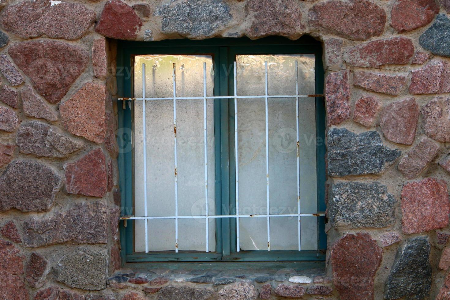 A small window in a residential building in a big city photo