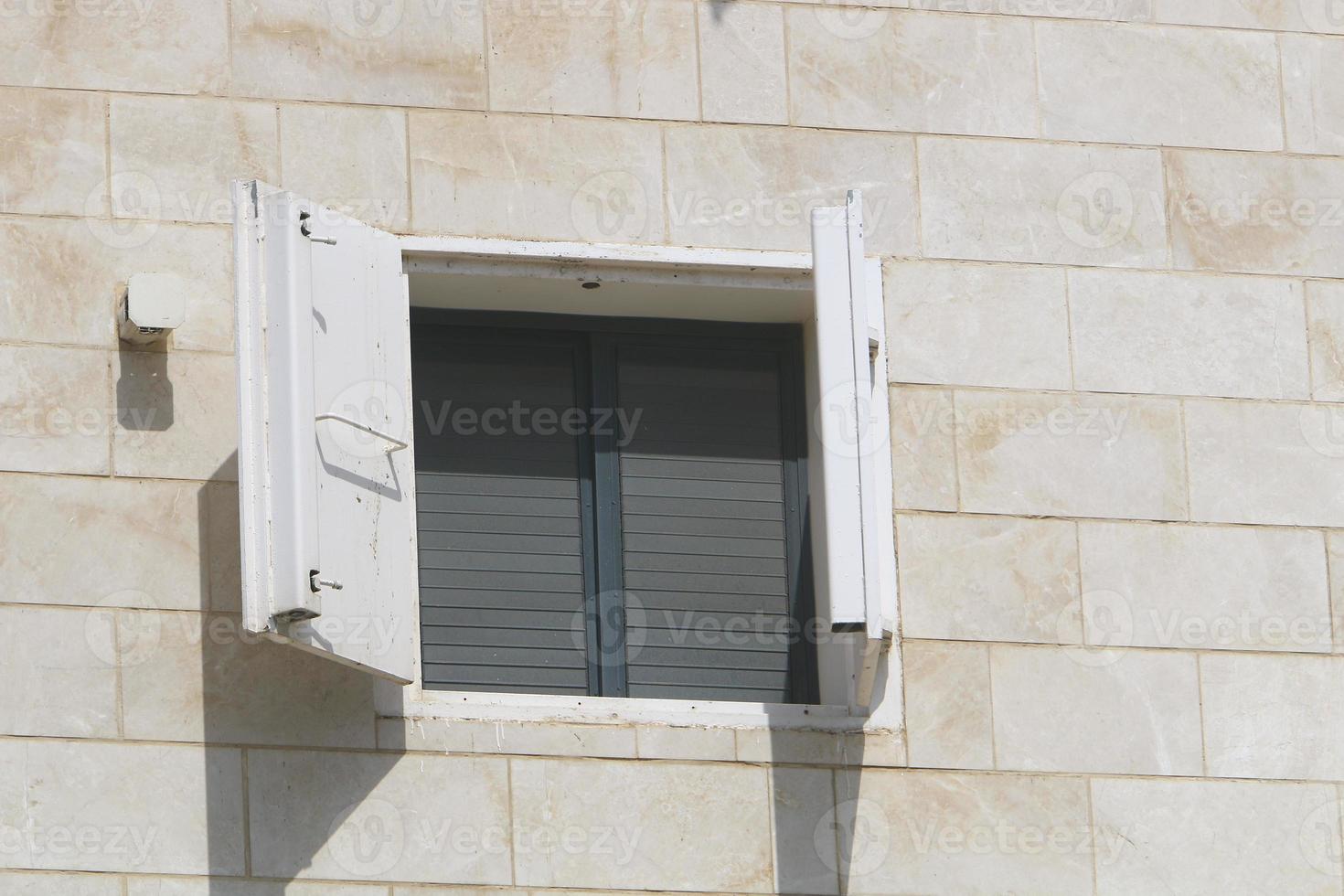 A small window in a residential building in a big city photo