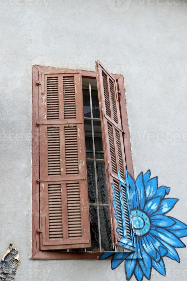 A small window in a residential building in a big city photo