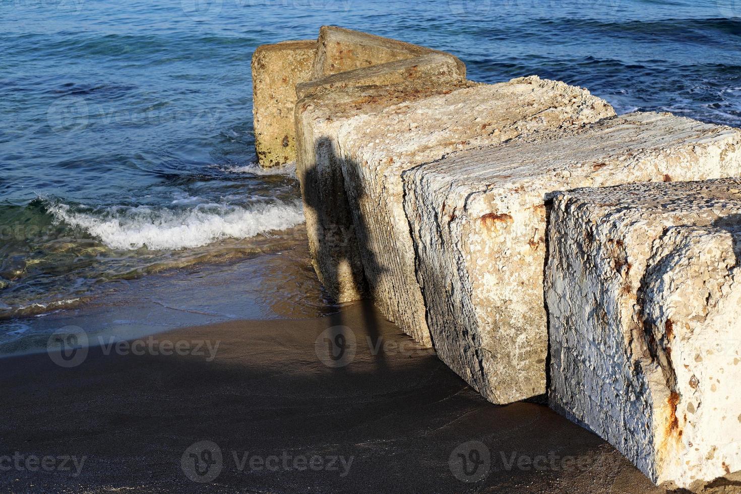 Photographer's shadow on the seashore. photo