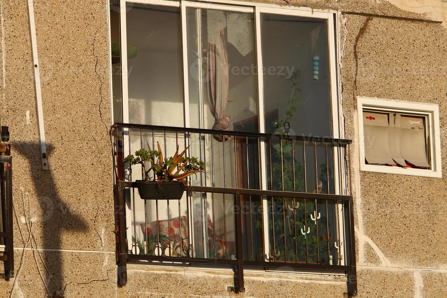 A small window in a residential building in a big city photo