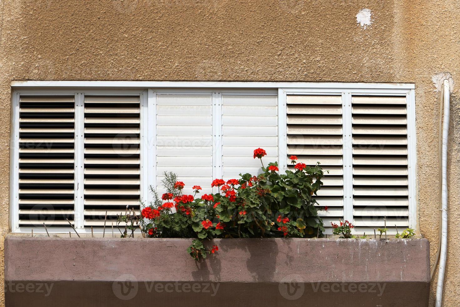 A small window in a residential building in a big city photo