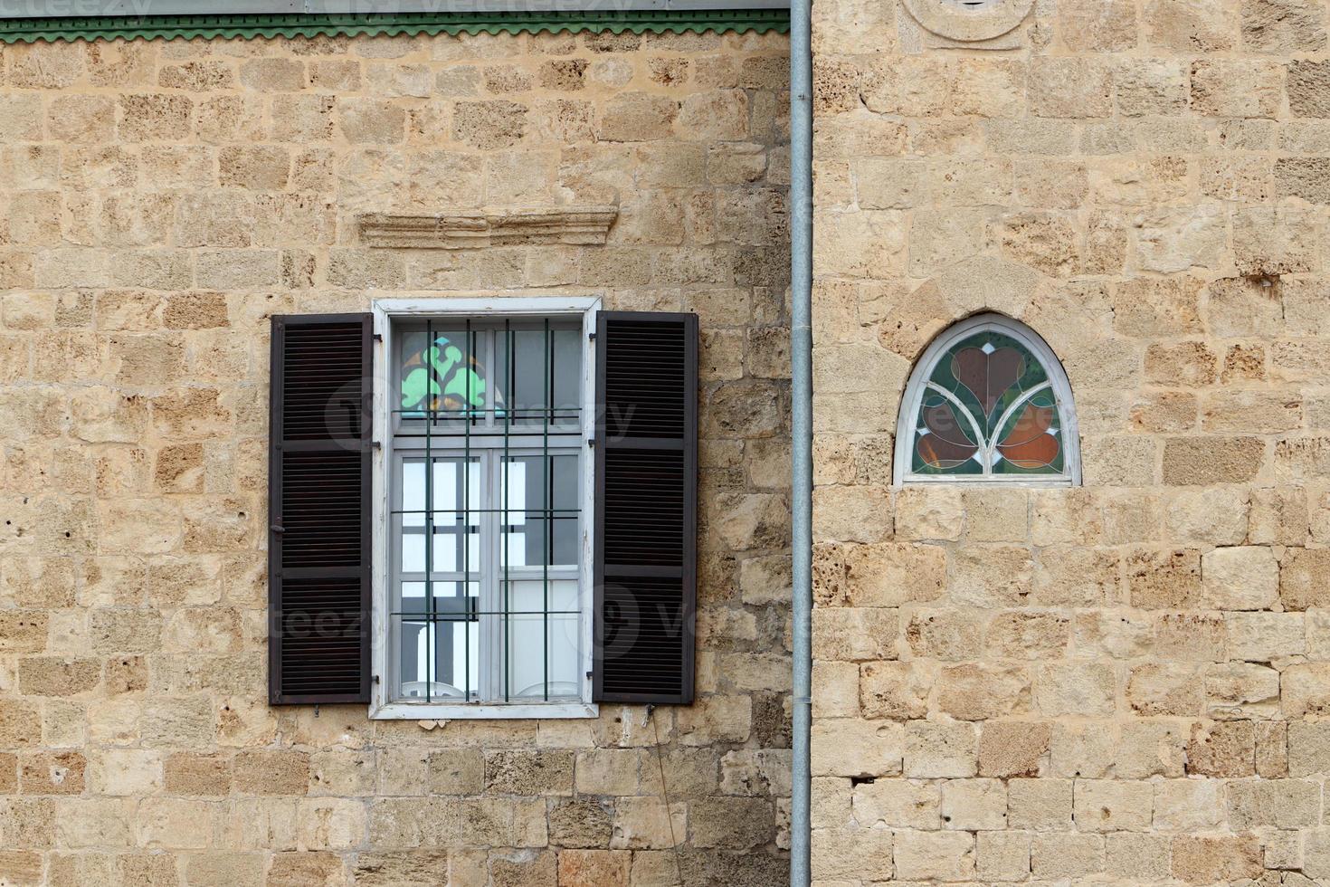 A small window in a residential building in a big city photo