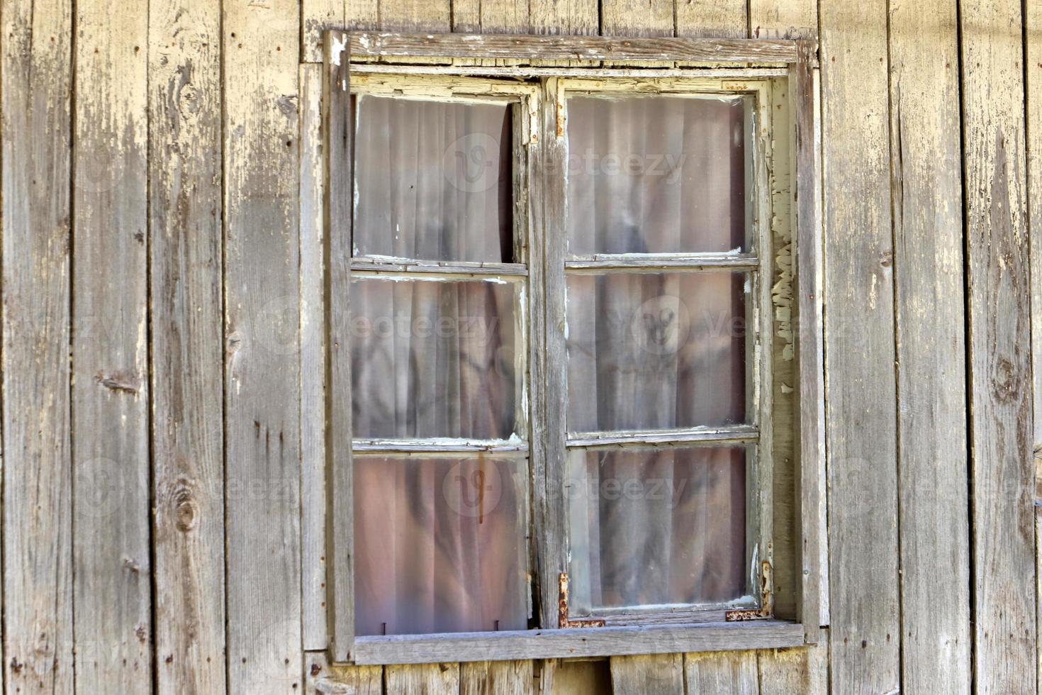 A small window in a residential building in a big city photo