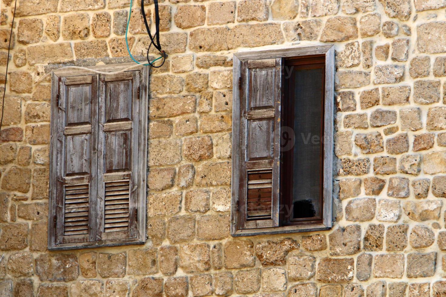 A small window in a residential building in a big city photo