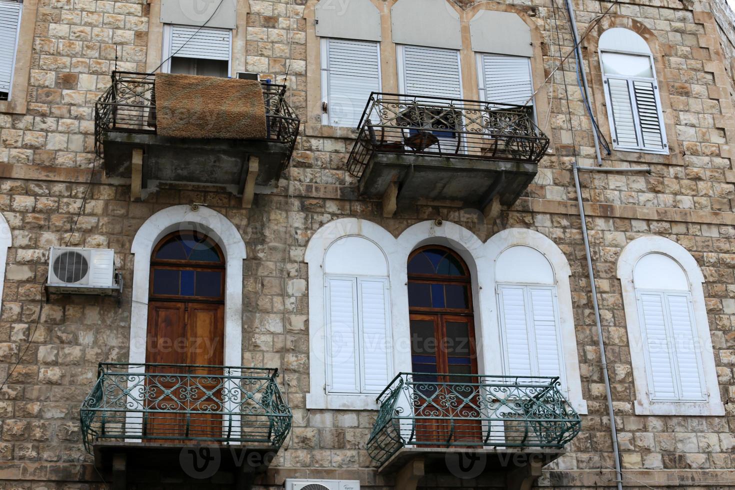 Balcony - a platform with railings protruding on the upper floors of the building. photo
