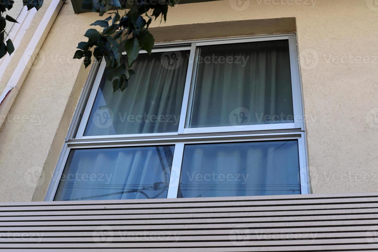 A small window in a residential building in a big city photo