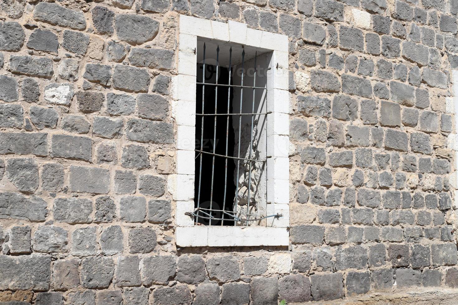 A small window in a residential building in a big city photo
