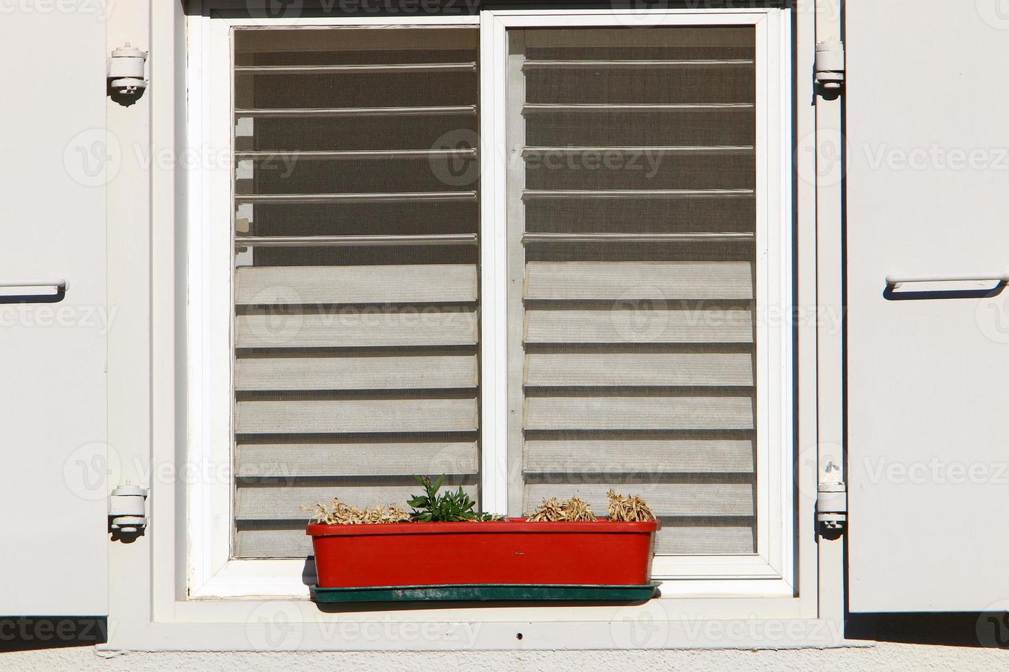 A small window in a residential building in a big city photo