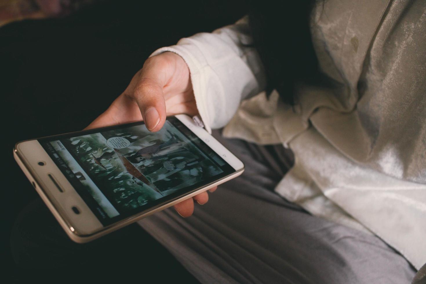 Closeup Of Smart Phone With Web Comics On It in Karachi Pakistan 2022 photo