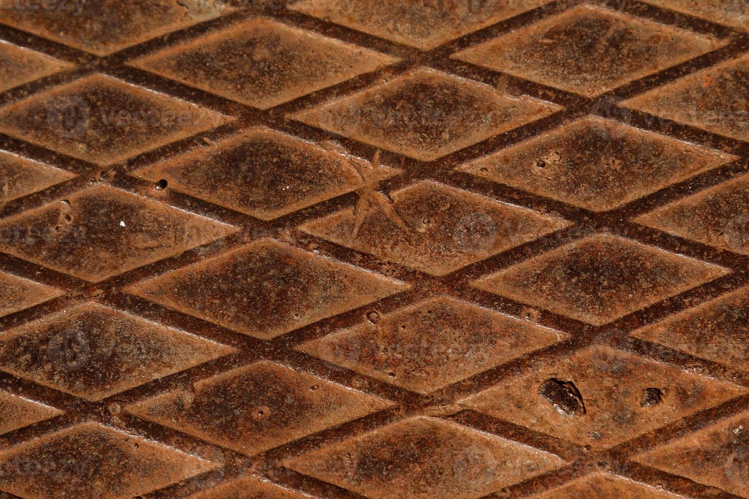 Rusty metal texture. Steel surface with rhombus pattern photo