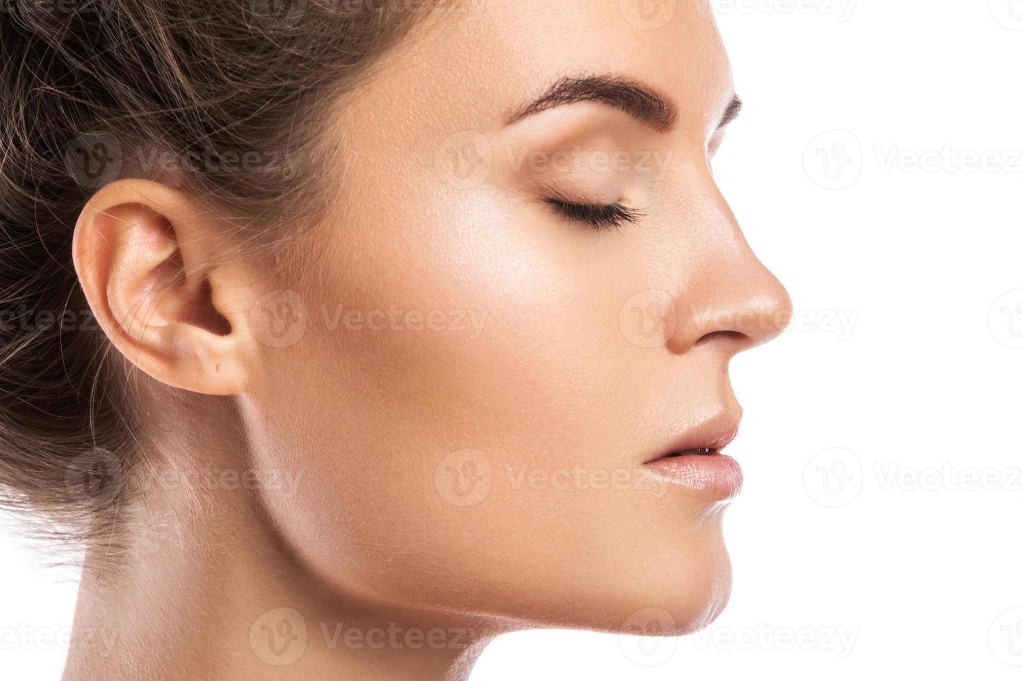 Female face in profile on white background photo