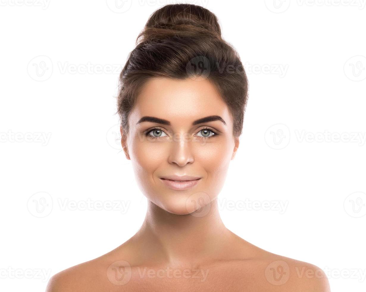 Portrait of beautiful young woman against white background photo