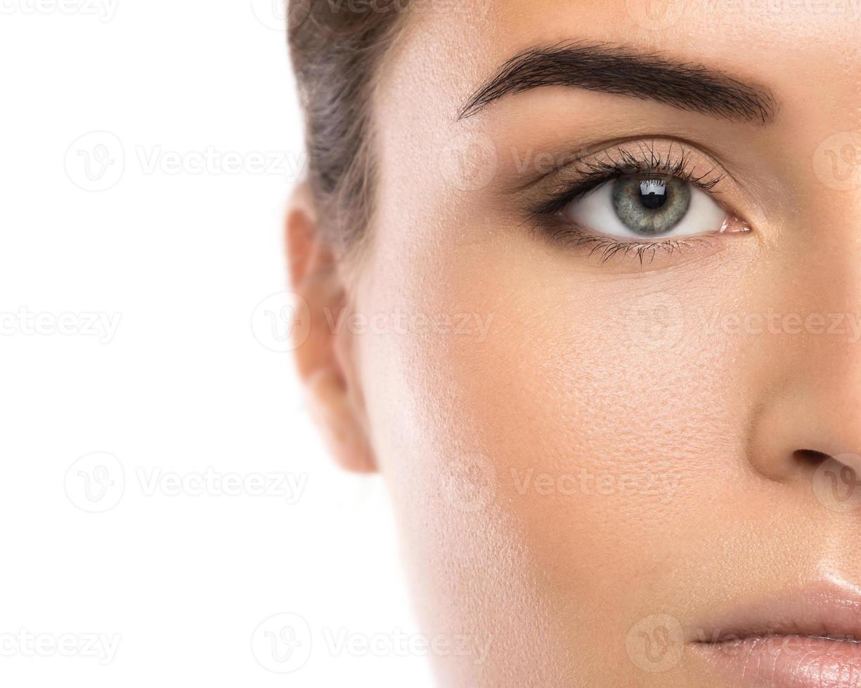 Half of female face on white background photo