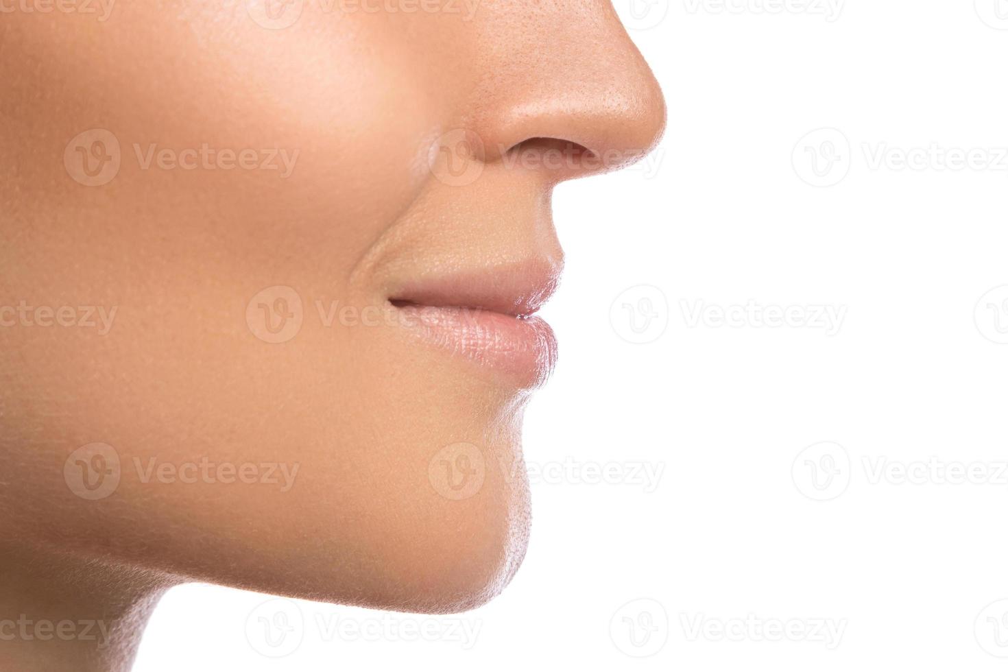 Closeup of beautiful female lips on white background photo