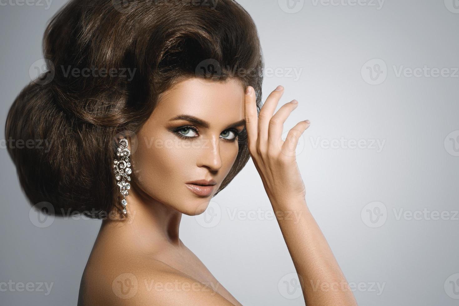 Gorgeous woman with a beautiful hairstyle and make-up photo