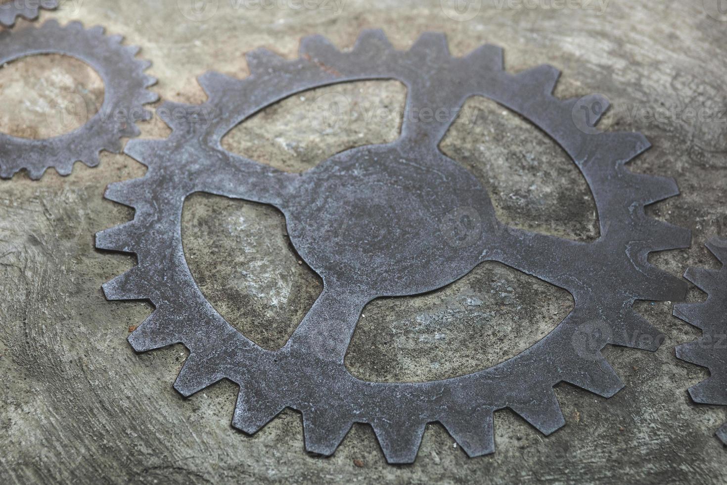 Old and rusty gears inside the concrete wall photo