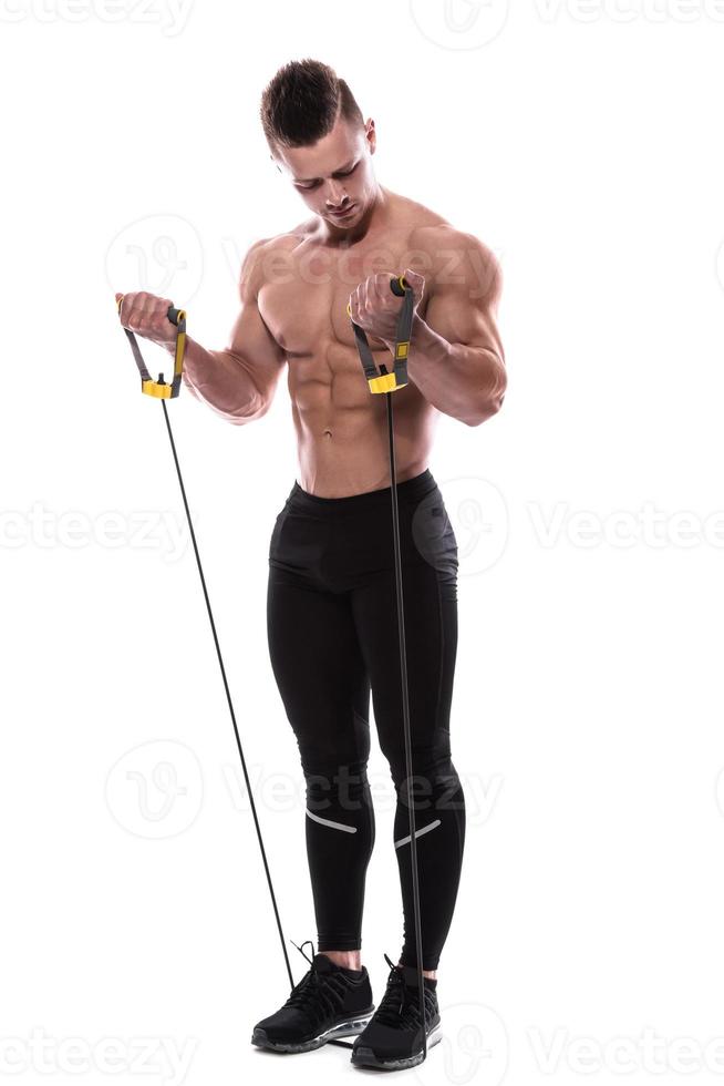Bodybuilder working out with rubber band over white background photo