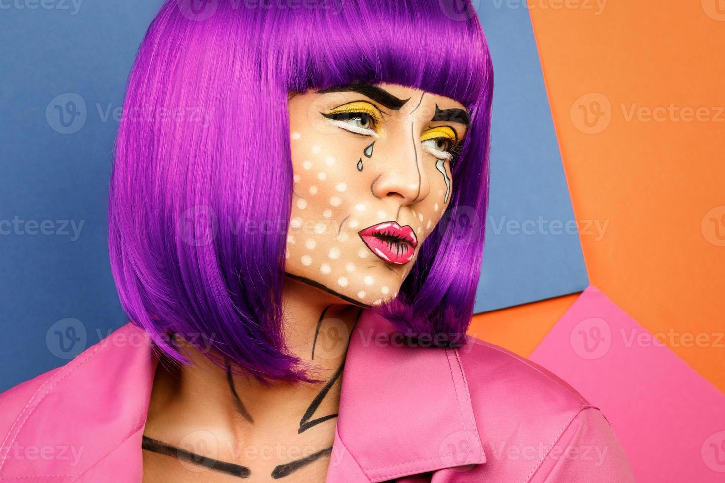 Model in creative image with pop art makeup photo