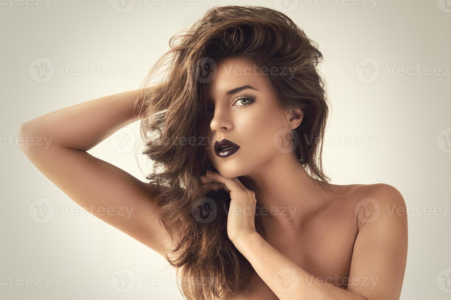 Portrait of beautiful woman with dark lipstick photo