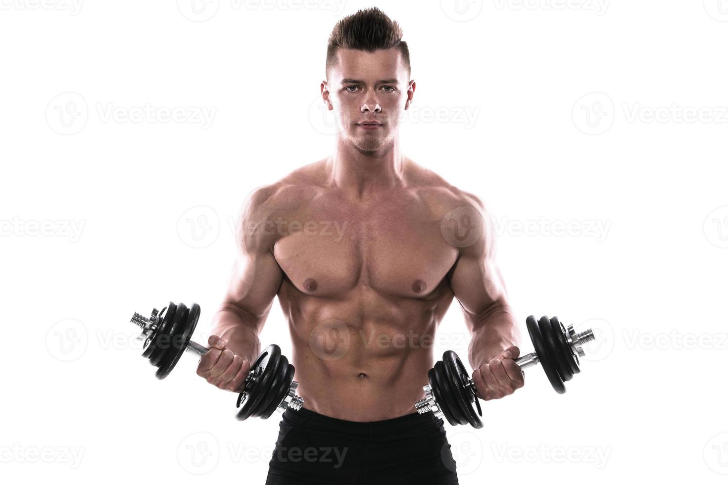 Bodybuilder with heavy dumbbells over white background photo