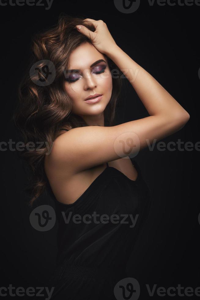 Woman with curly hair and beautiful make-up photo