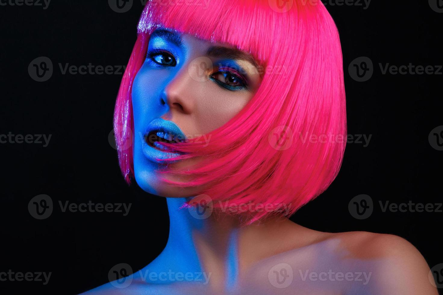 Potrait of young woman with pink hair photo
