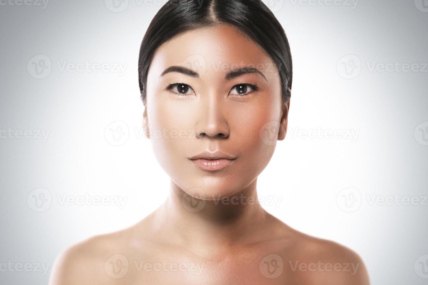 Difference in skin brightness. Concept of facial whitening or sun protection. photo