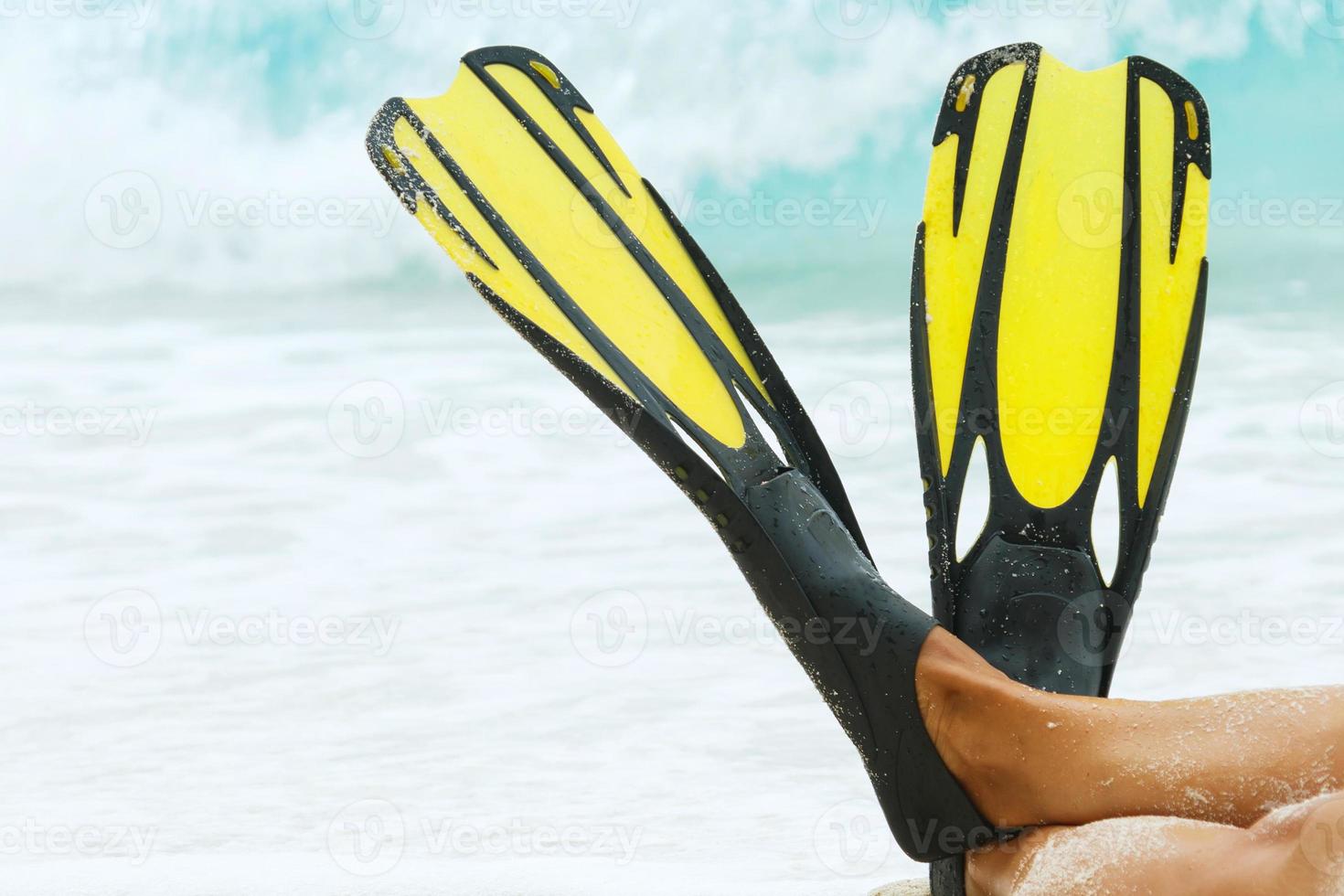 Female legs in flippers photo