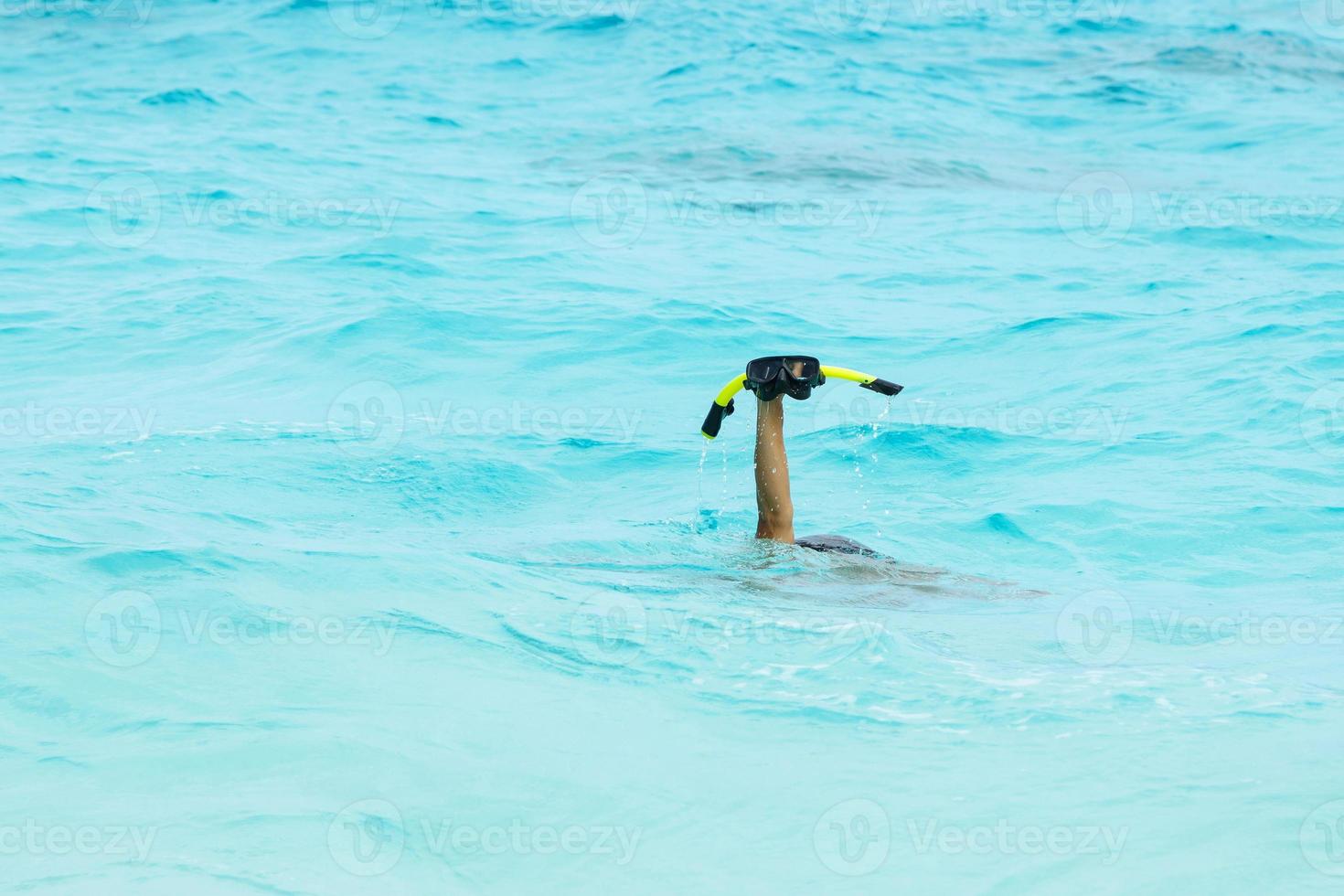 Hand with a mask for snorkeling photo