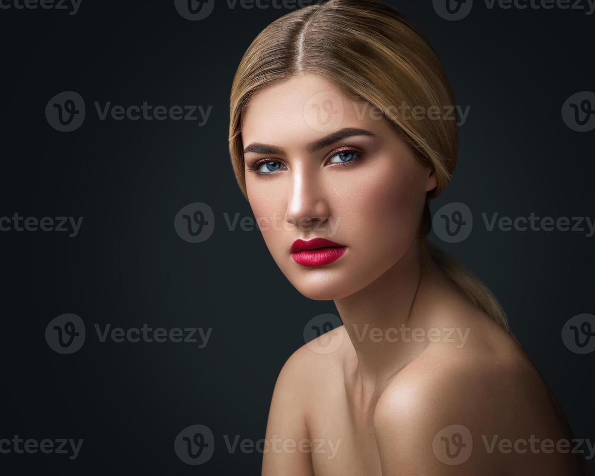 Portrait of blonde girl with red lips photo