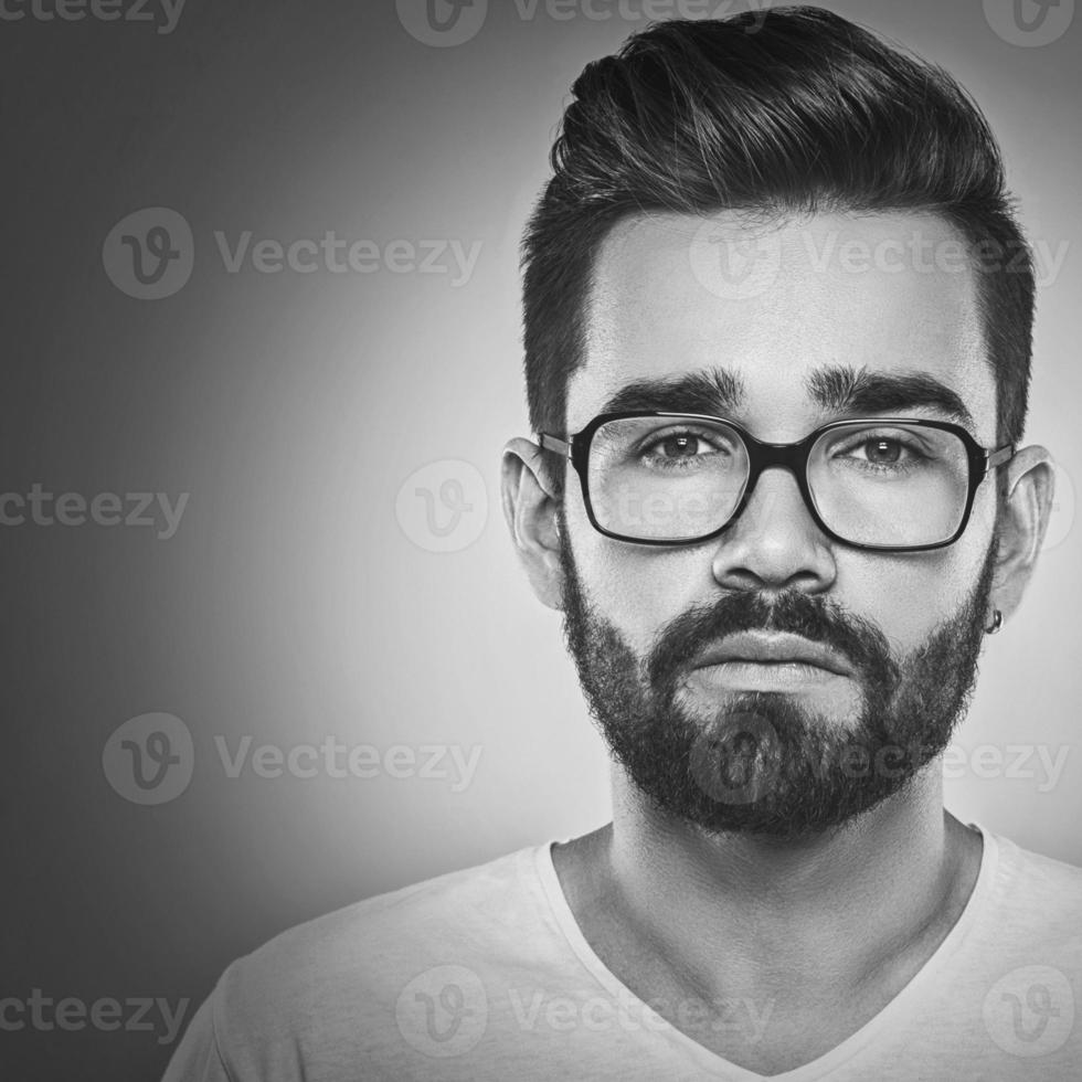 Close up of bearded man in eyeglasses photo