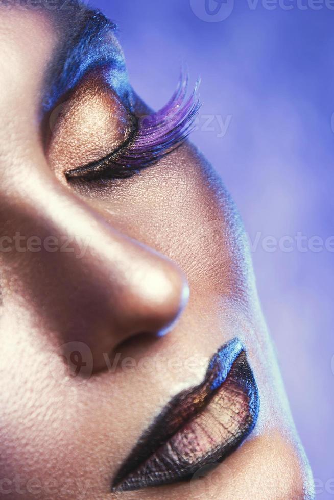 Model with a beautiful and creative vivid makeup photo