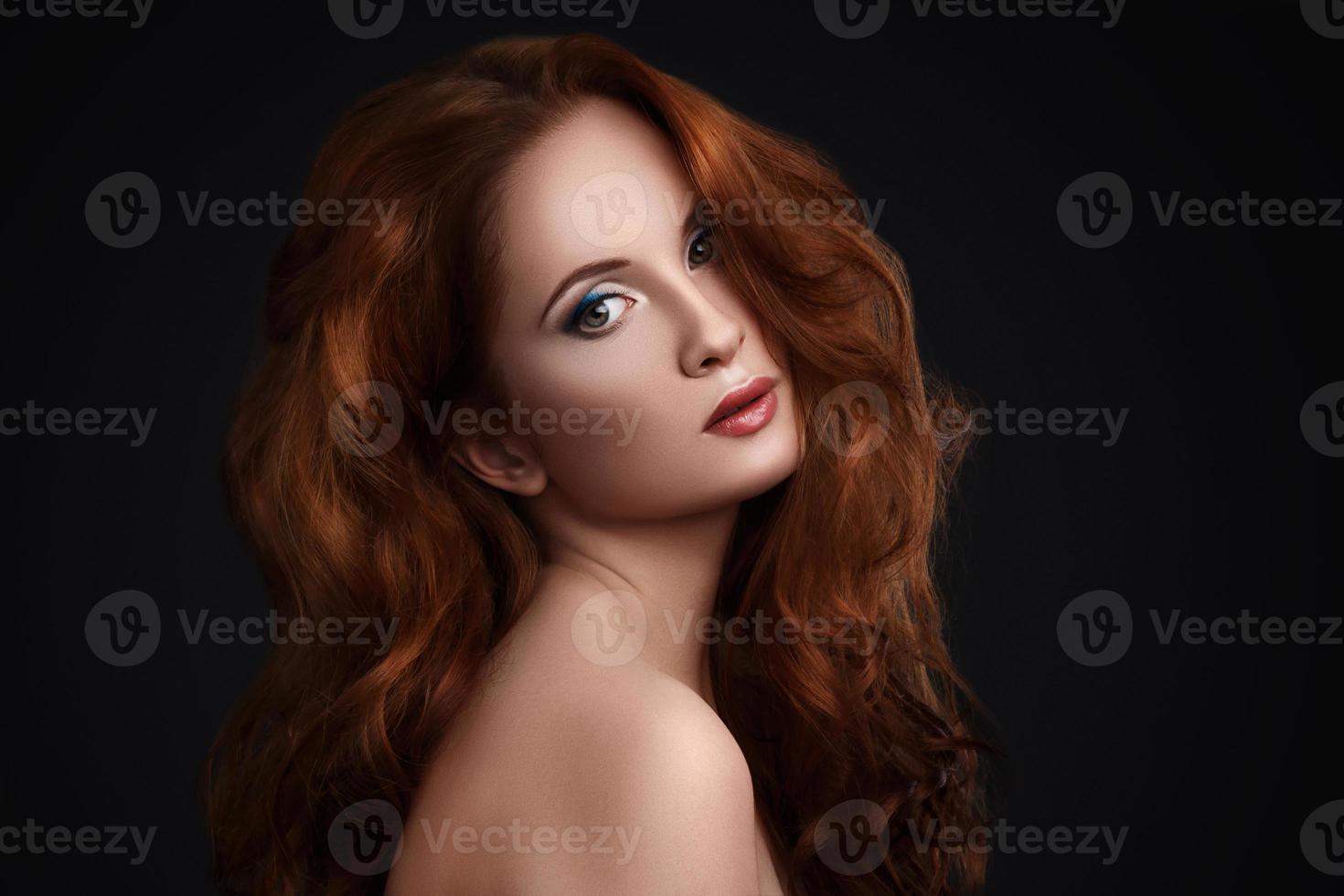Portrait of woman with beautiful red hair photo