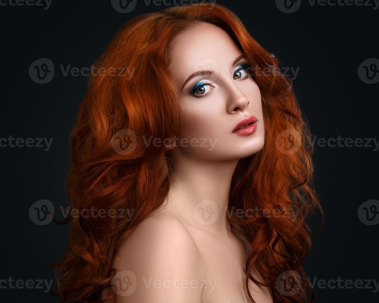 Portrait of woman with beautiful red hair photo