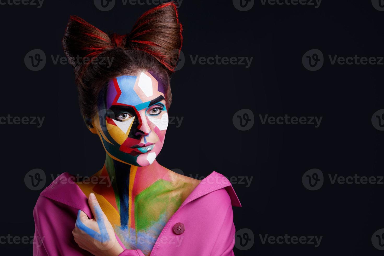 Model with a creative pop art makeup on her face. photo