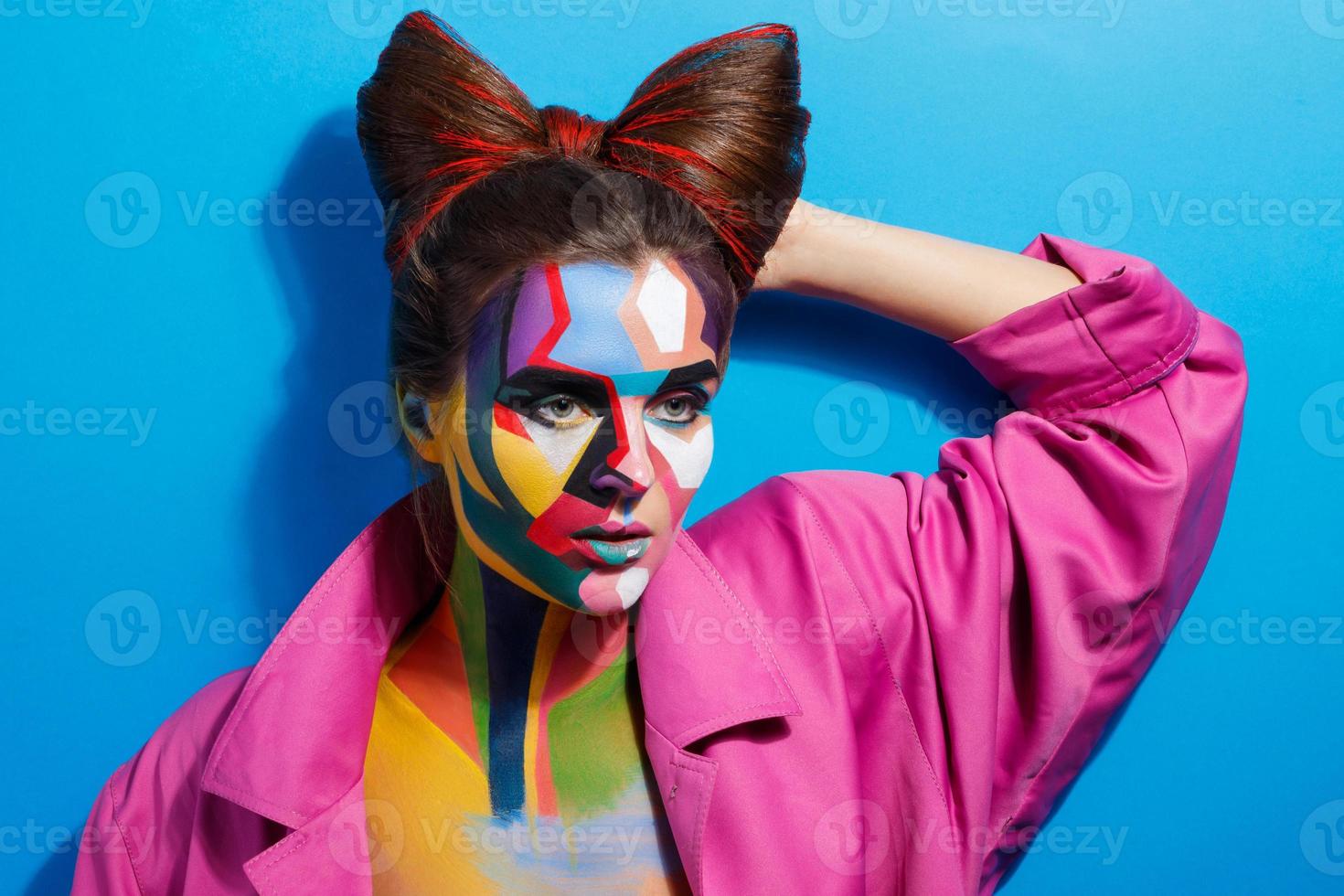 Model with a creative pop art make-up on her face photo