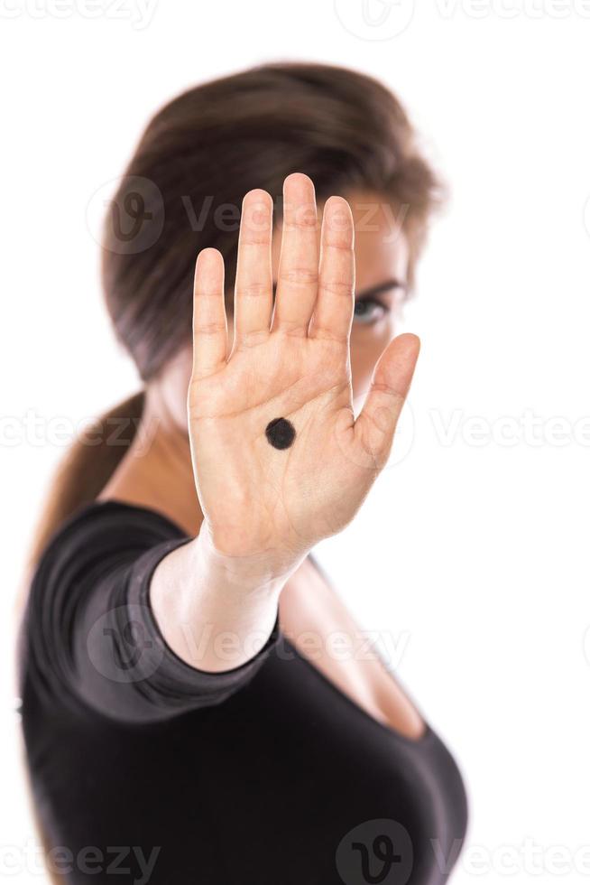 The Black Dot Campaign. Sign of domestic violence photo