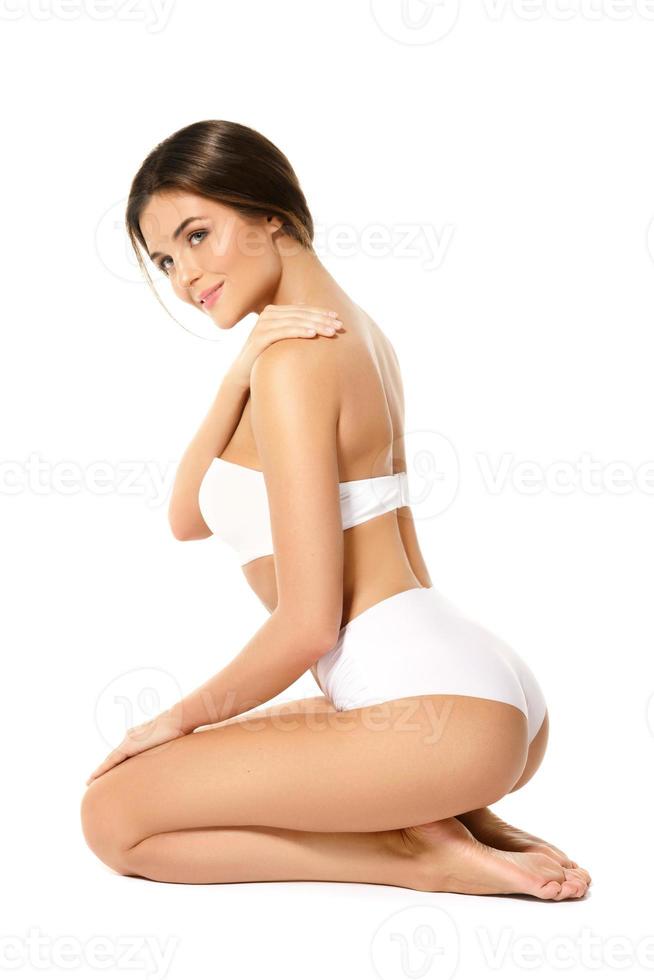 Woman with a beautiful body isolated on white background photo