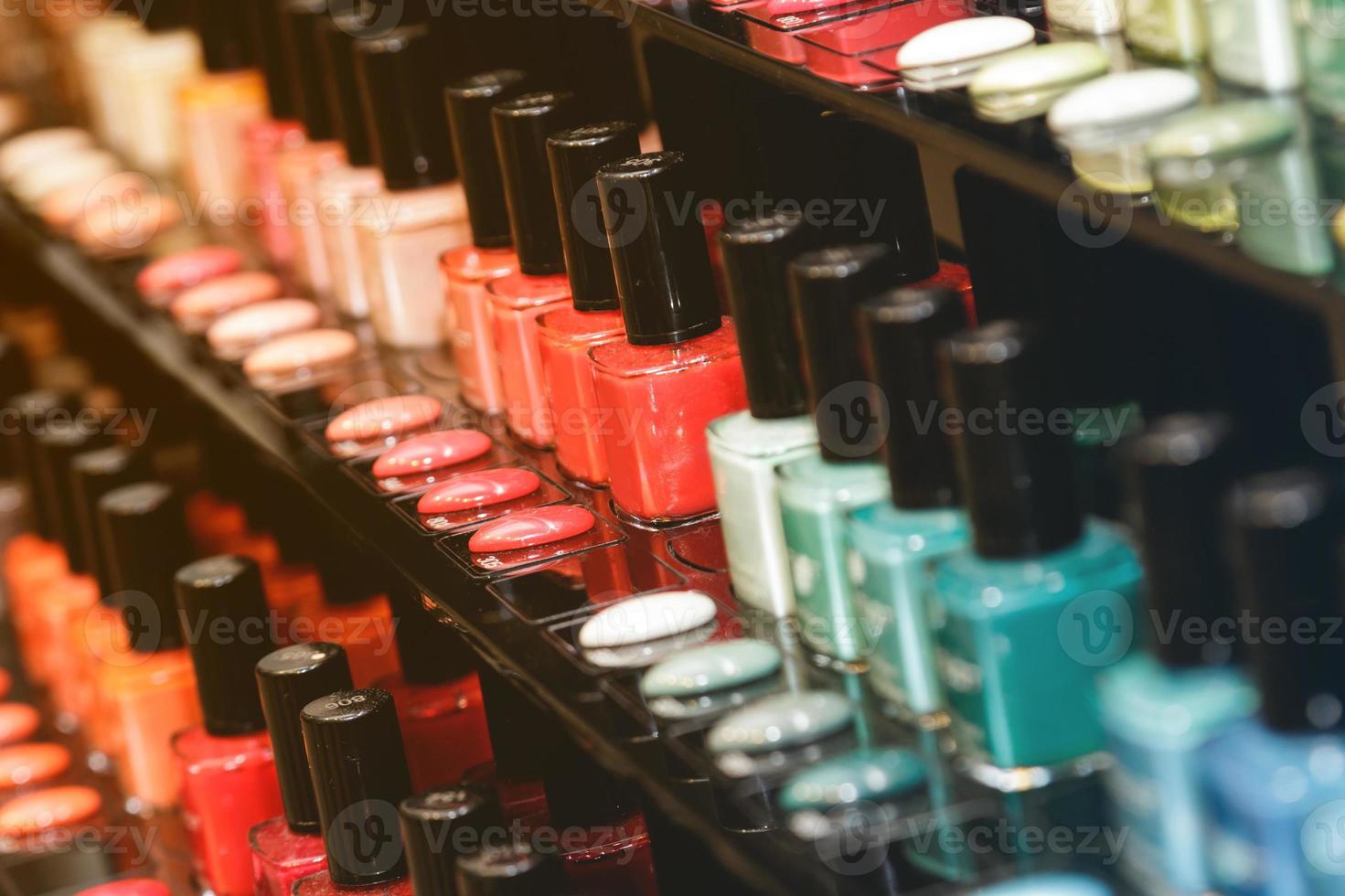 Closeup of different nail polishes in the shop photo