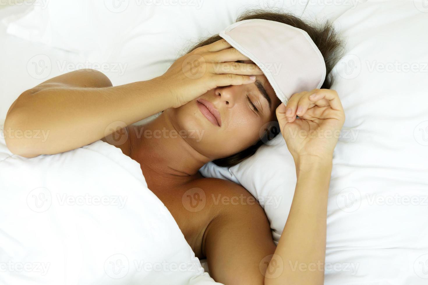 Woman is feeling bad after not enough sleeping photo