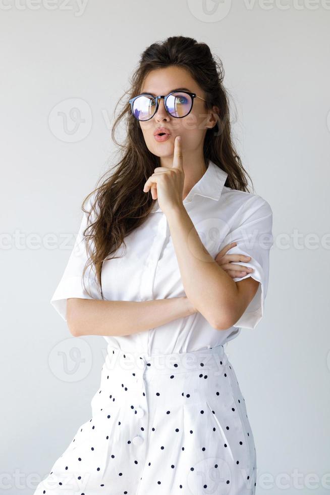 Young businesswoman wearing stylish clothes and eyeglasses photo