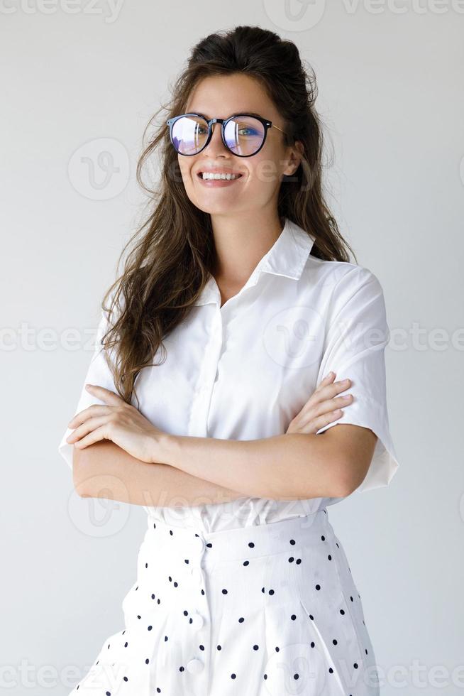 Young businesswoman wearing stylish clothes and eyeglasses photo