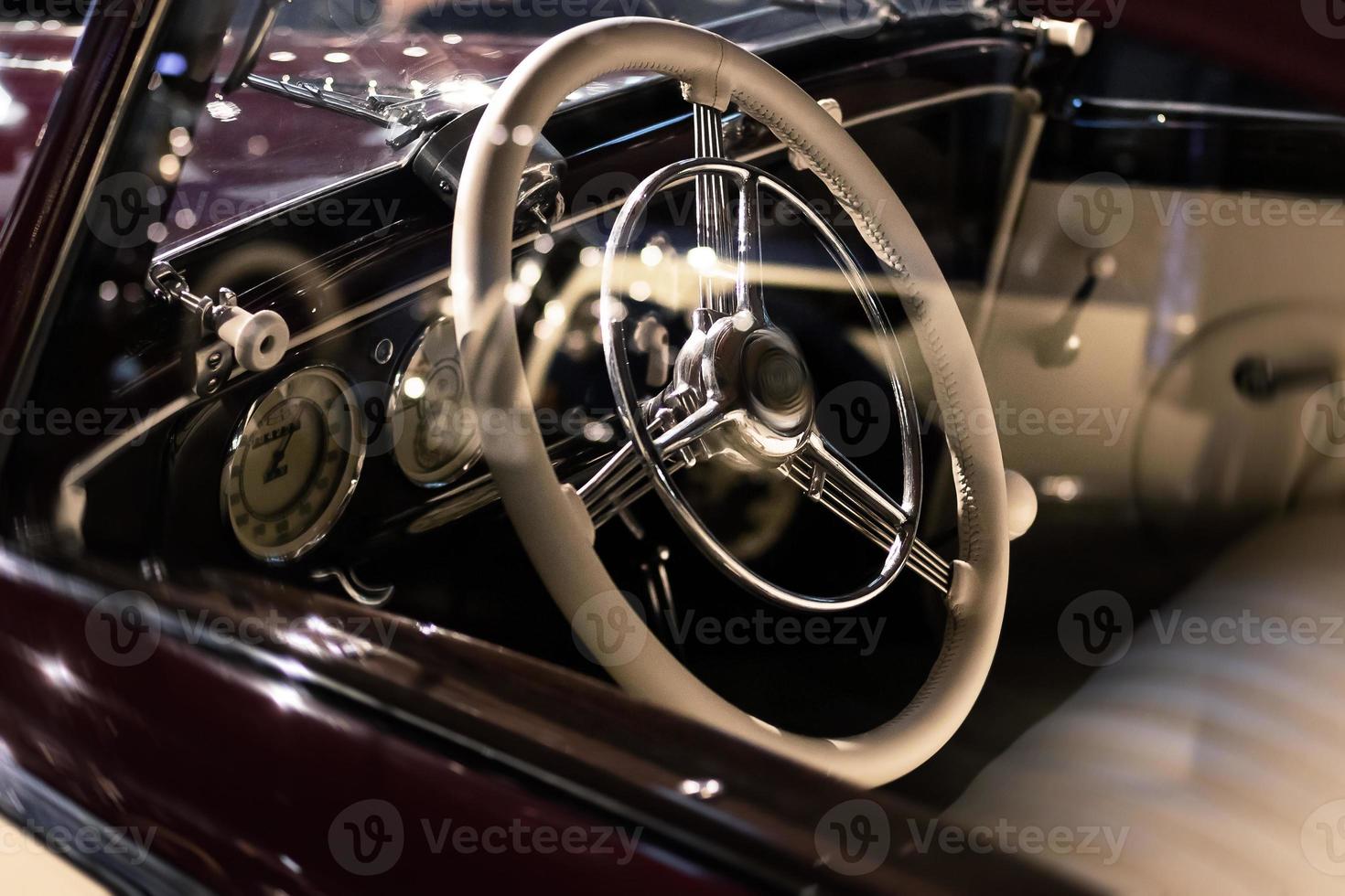 Steering wheel and part of interior of the retro photo