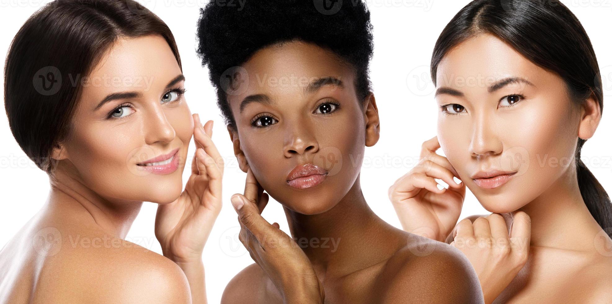 Different ethnicity women - Caucasian, African, Asian on white background photo