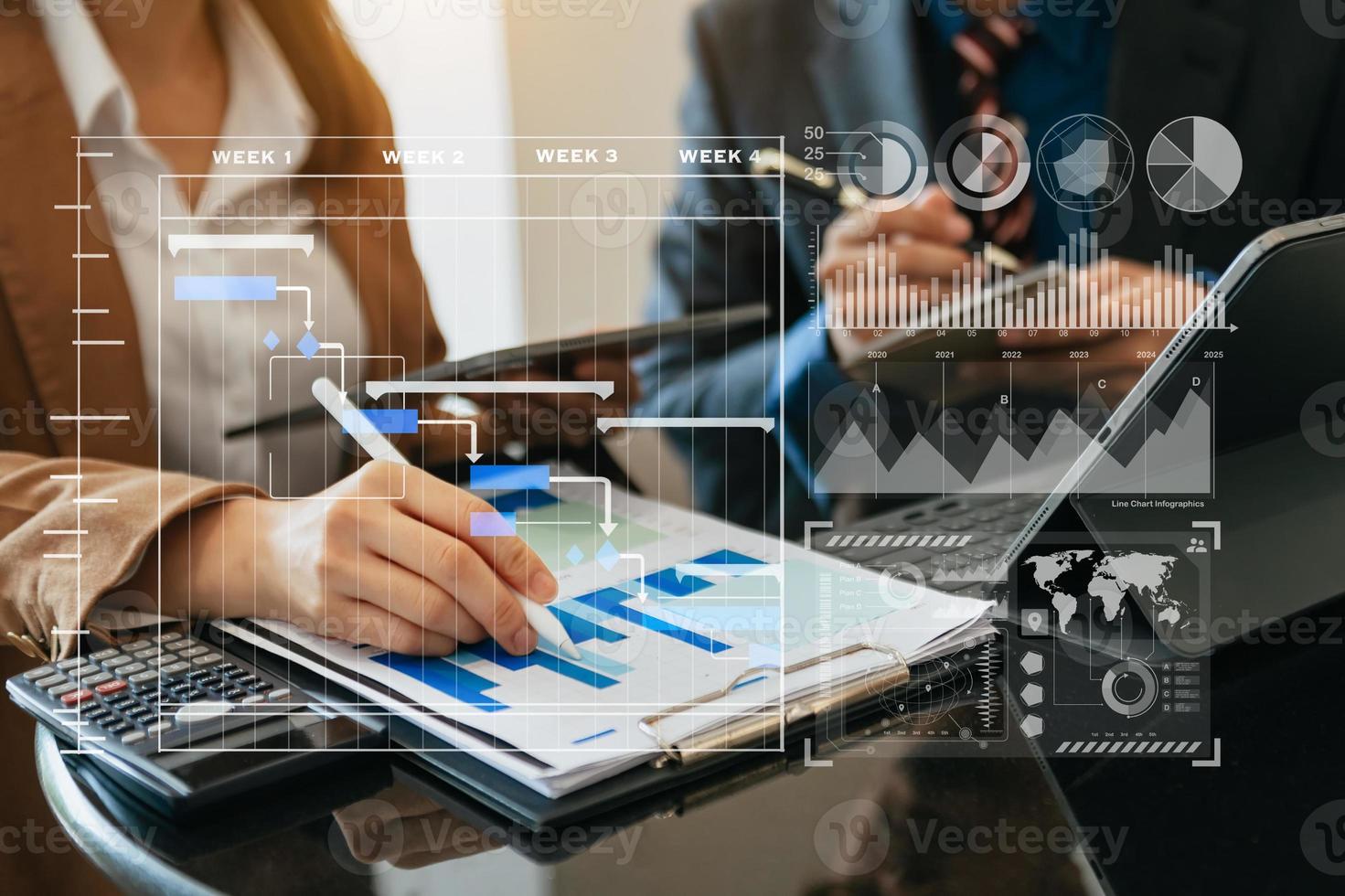 Businessman hand Project manager working and update tasks and Gantt chart scheduling virtual diagram.with smart phone, tablet and laptop photo