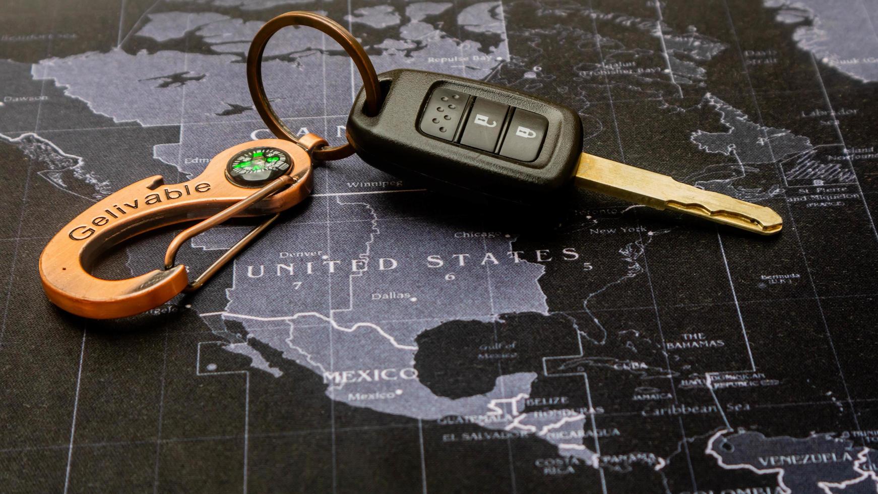 black car keys on black map photo