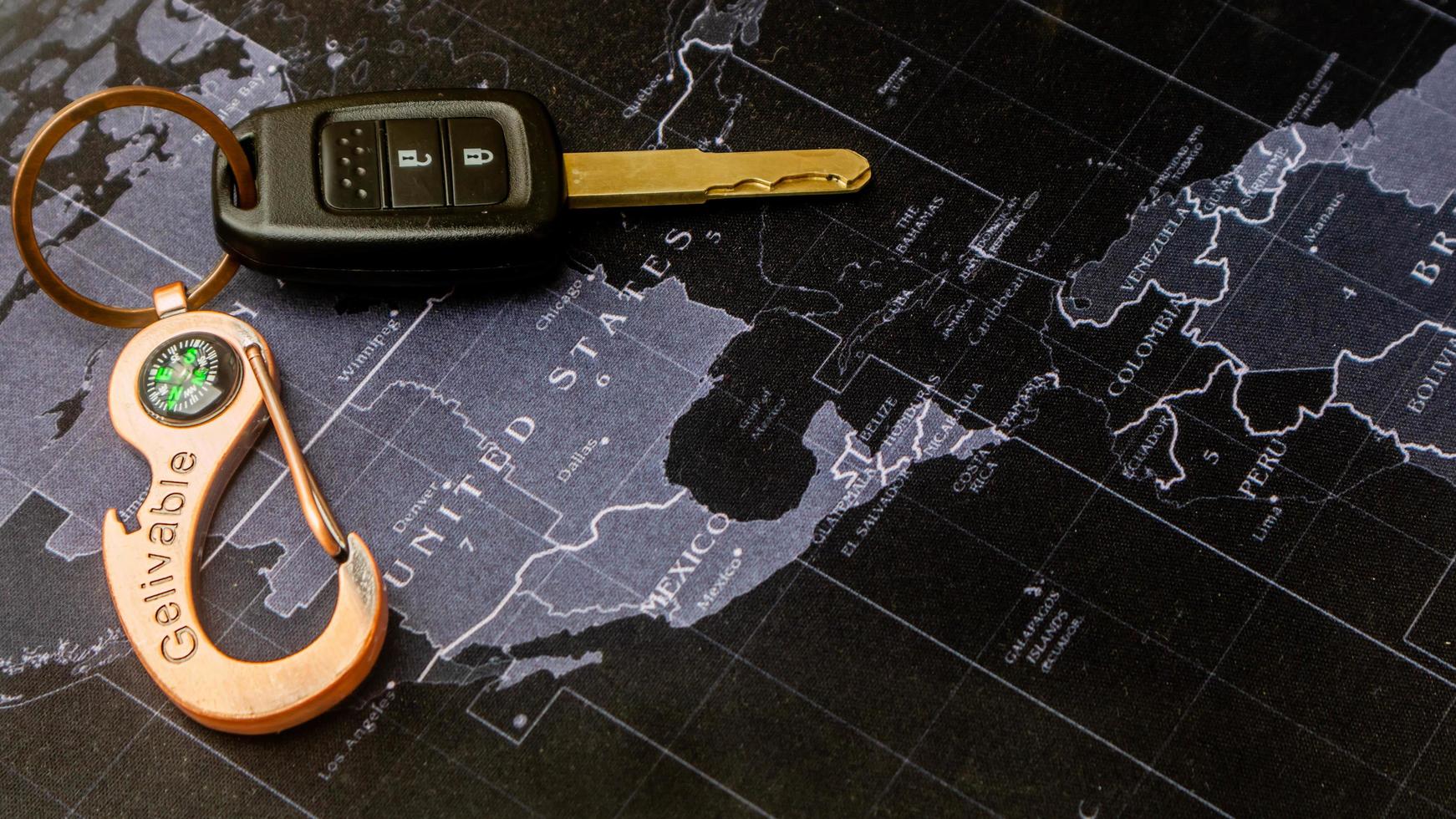 black car keys on black map photo