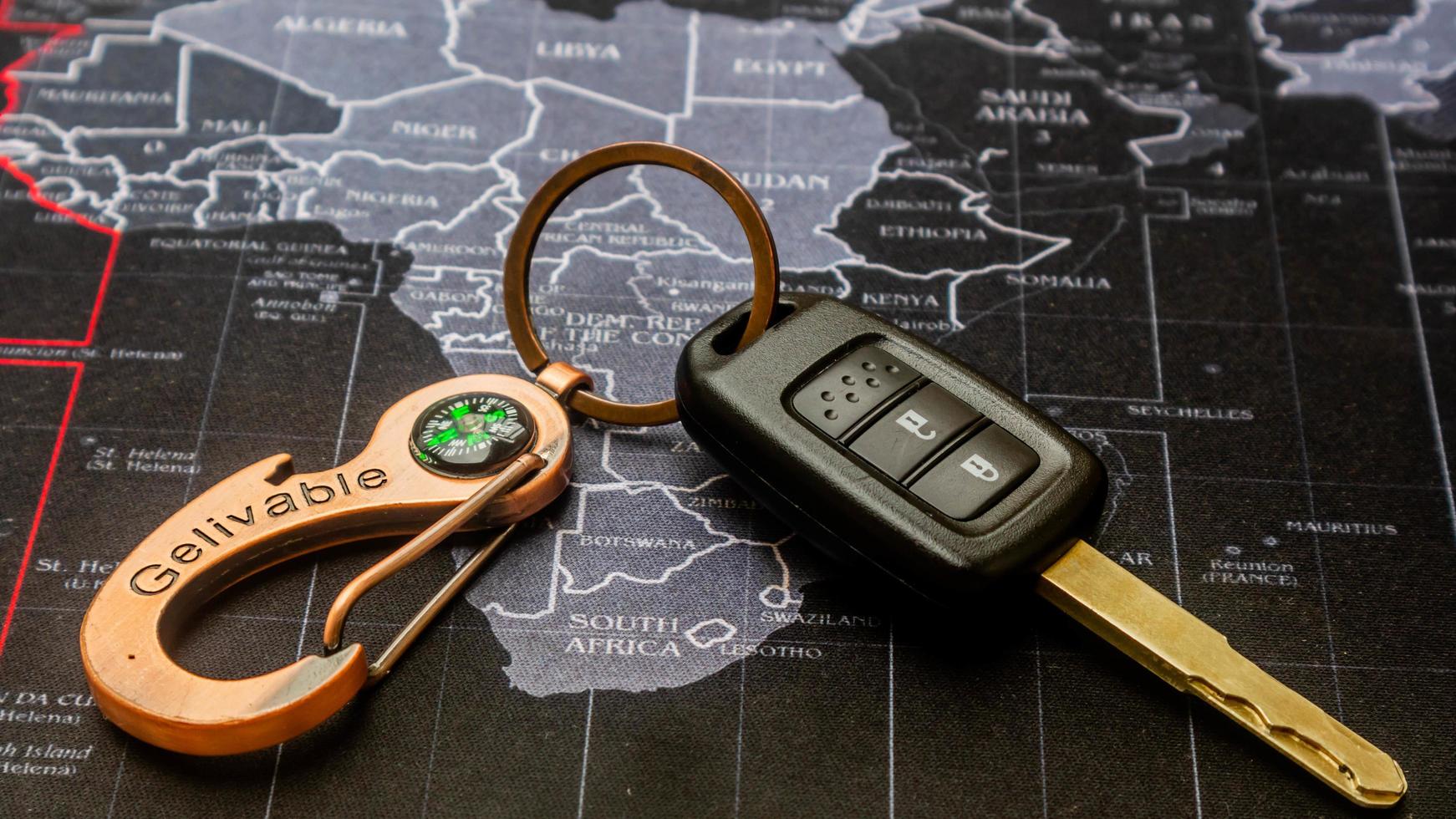 black car keys on black map photo