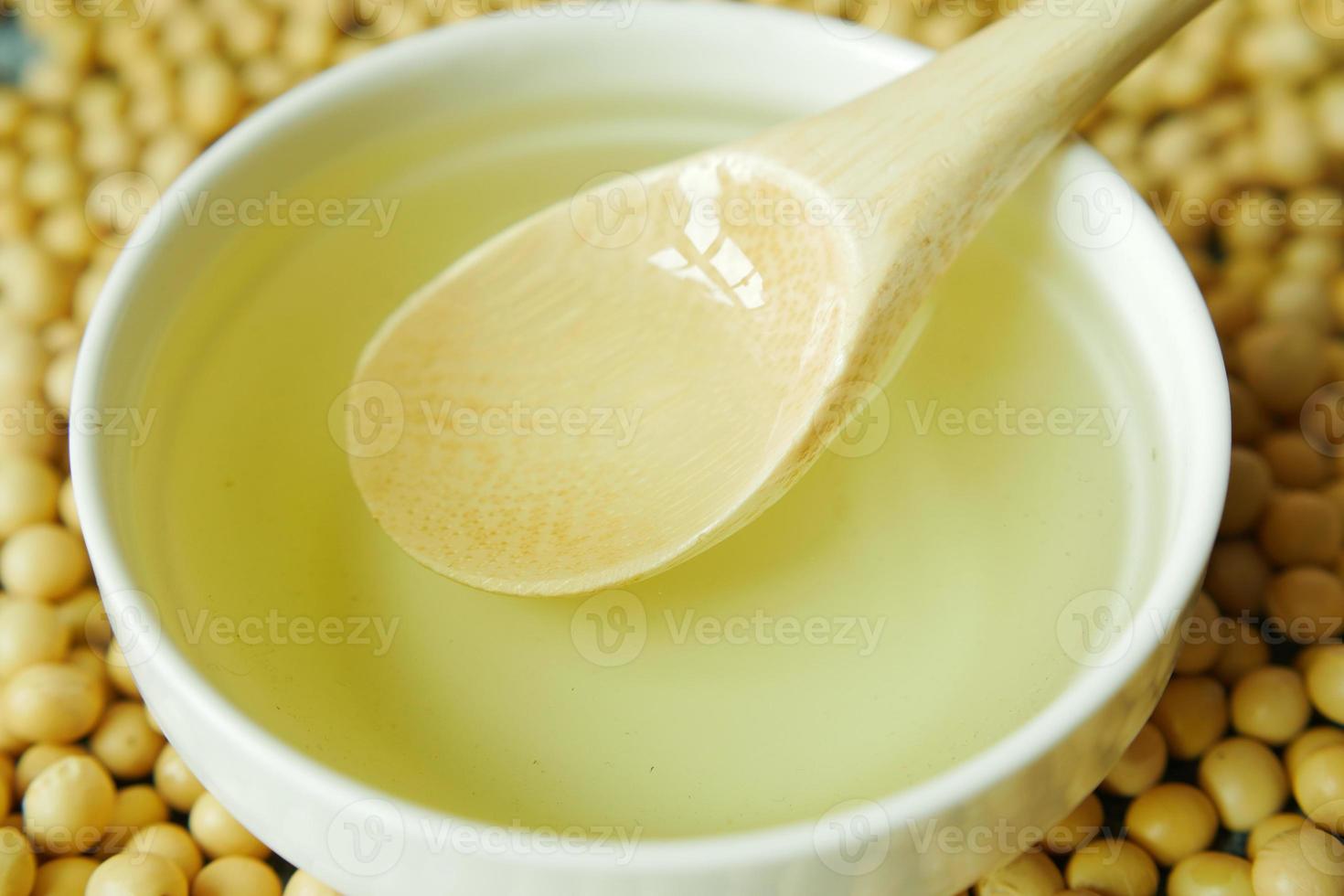 close up of Raw soy bean seed oil in a container photo